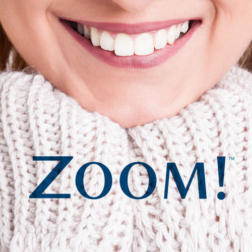 Woman with with white smile and the text Zoom!