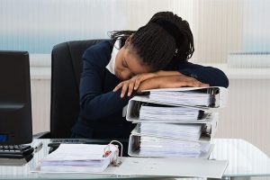 Woman with sleep apnea sleeping at work